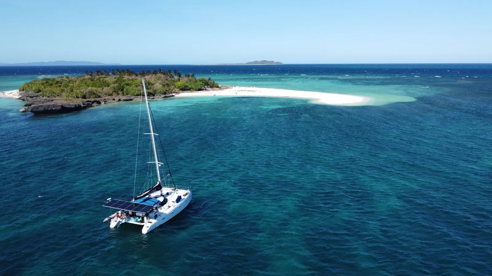 Soniya anchored beside jungle island with white-sand point