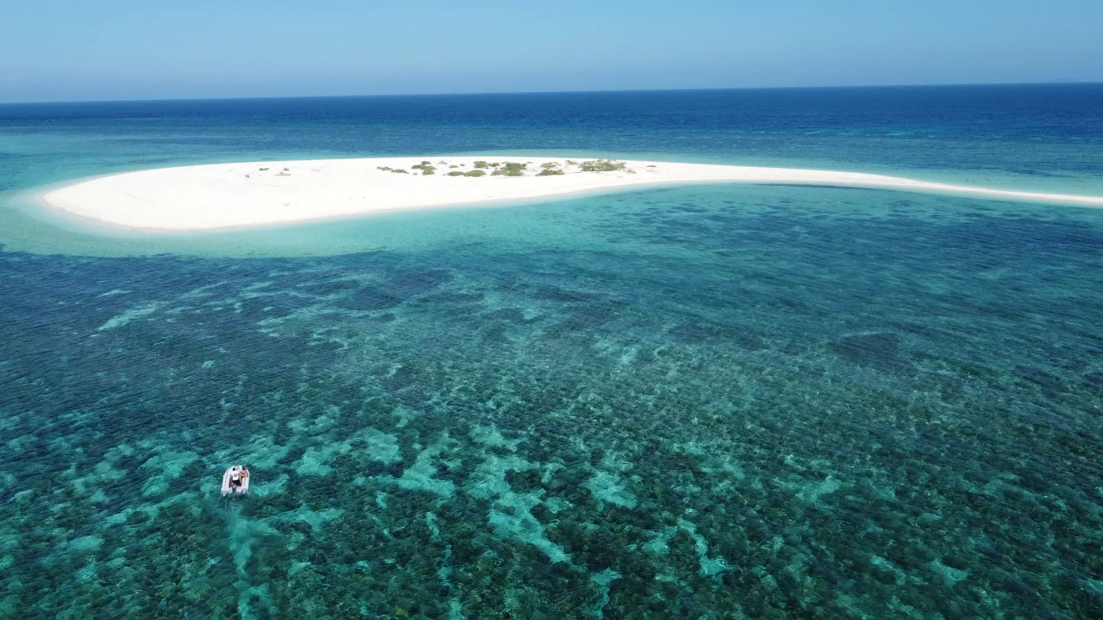 Sandbar and reef from wider angle, no boat visible