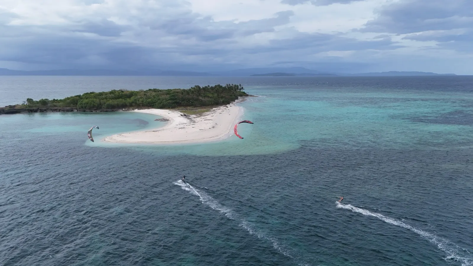 Aerial of Soniya near reef, beach and hills behind