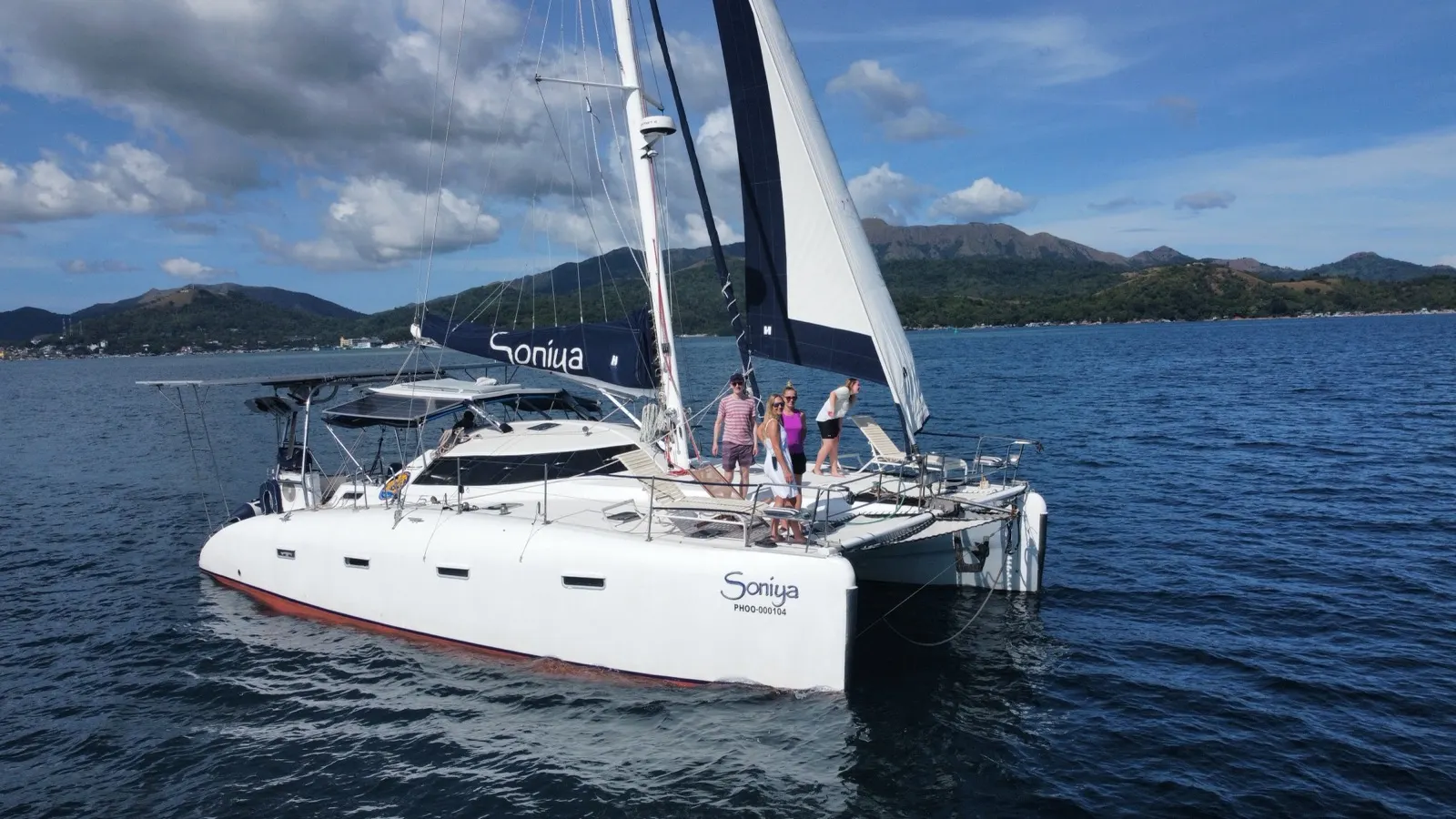 Soniya anchored in a jungle cove with dinghy approaching