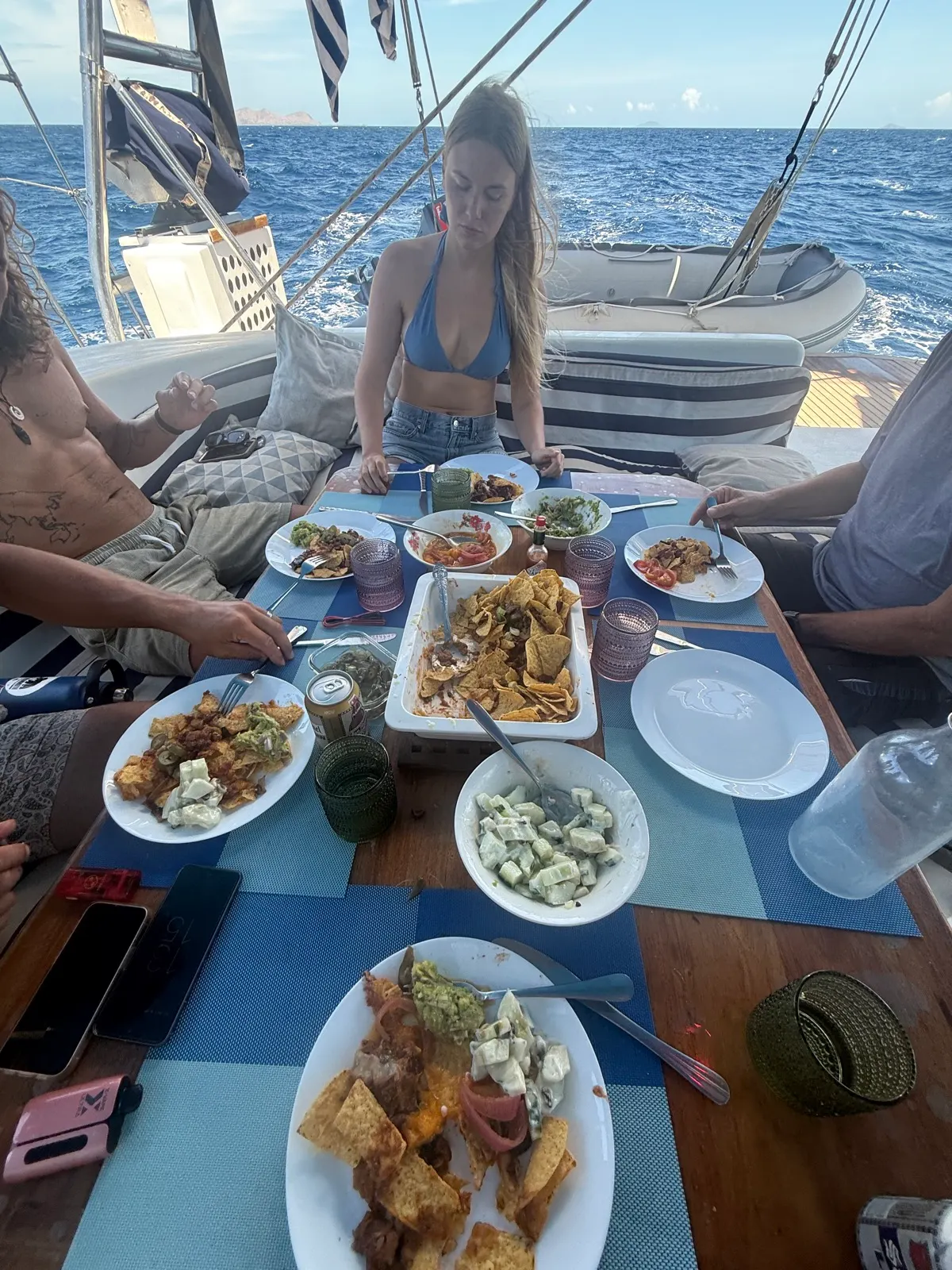 Group eating nachos and dips at cockpit table