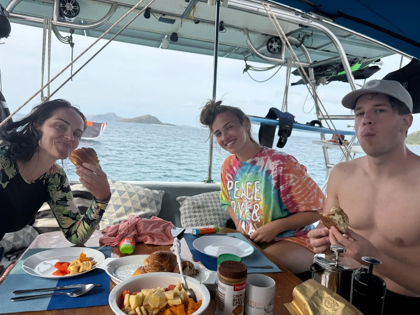 Group breakfast on deck with fruit and pastries