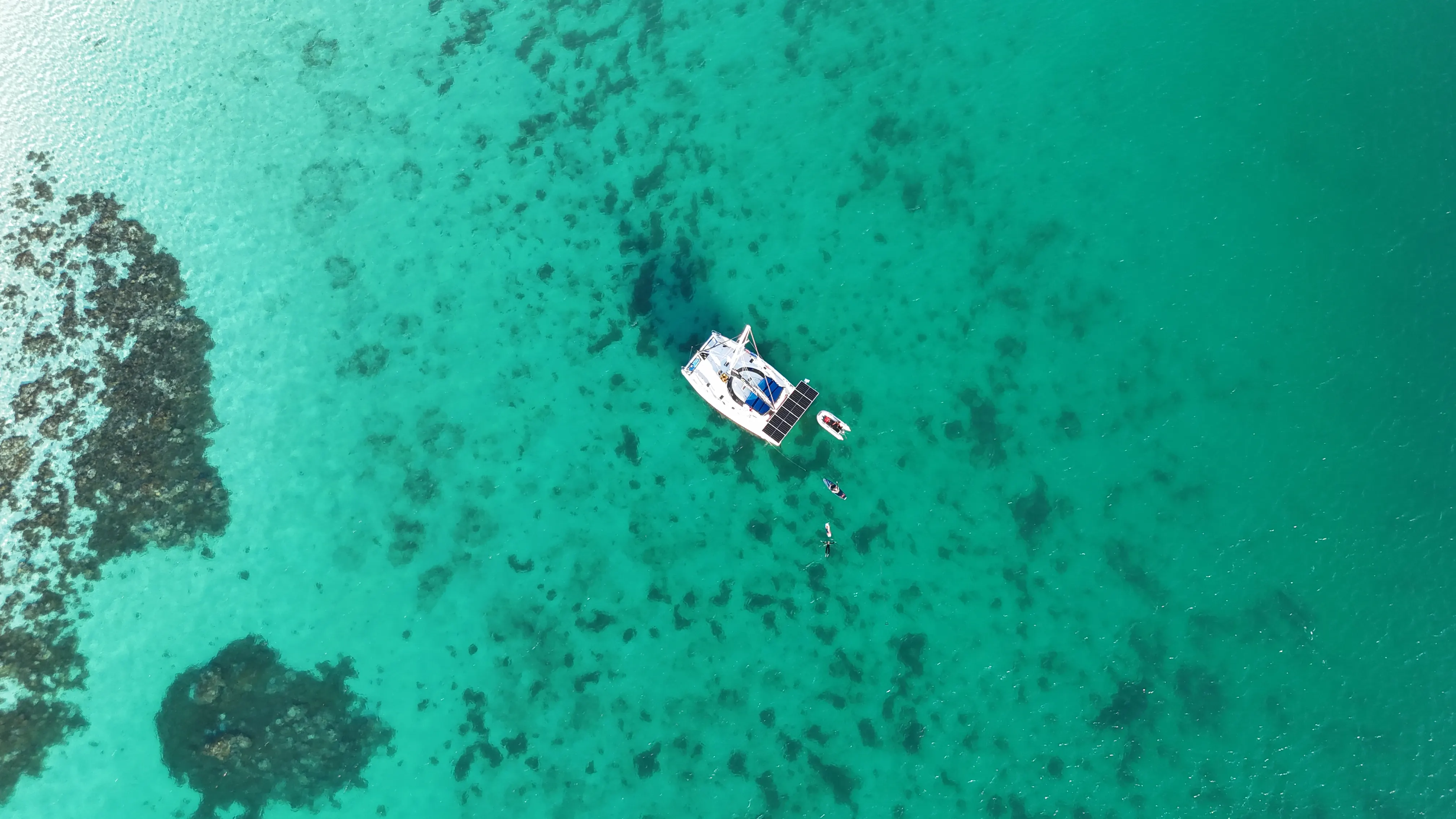 Soniya anchored in a limestone karst lagoon