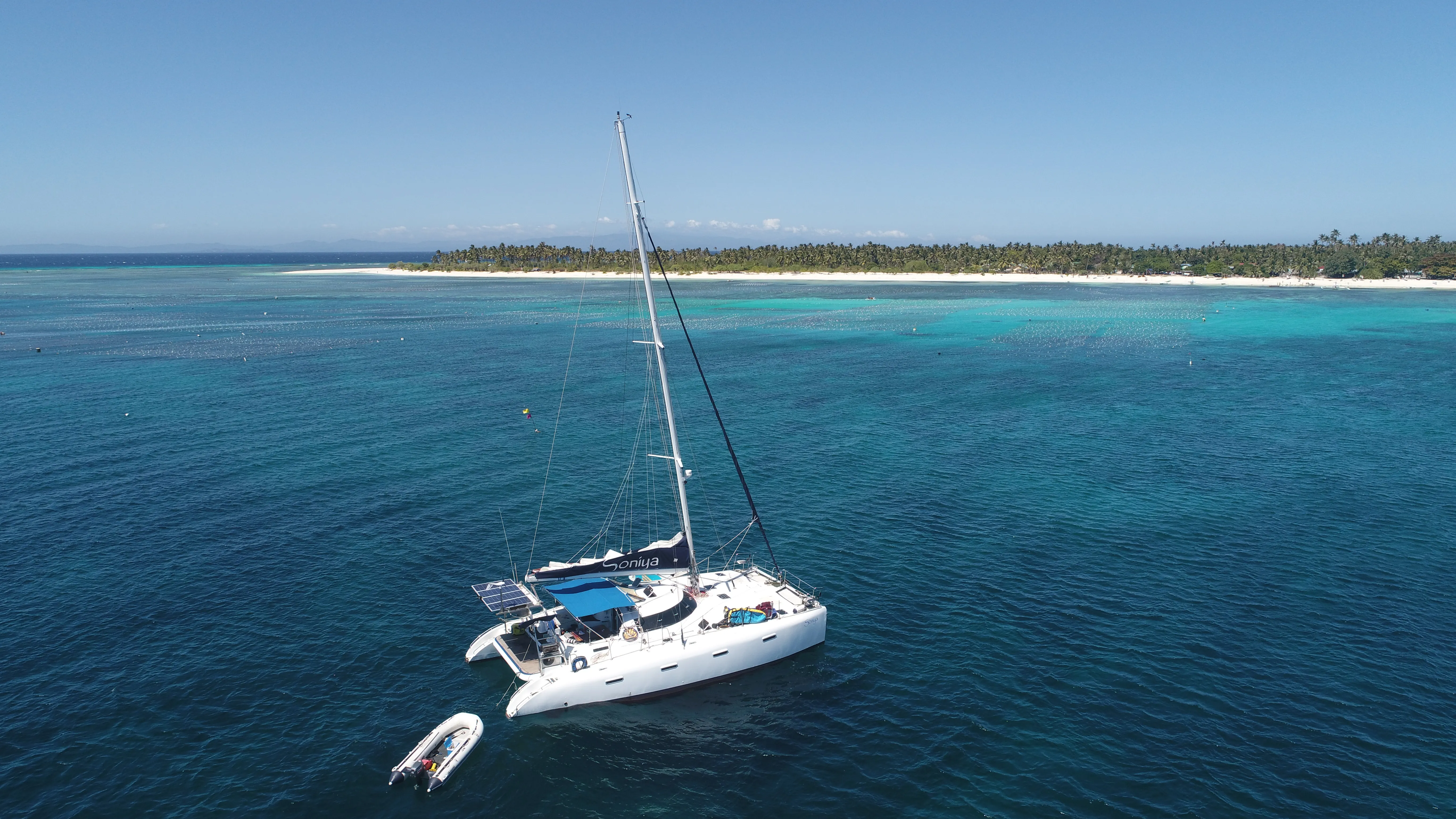 Aerial view of Soniya anchored near a Mindoro village