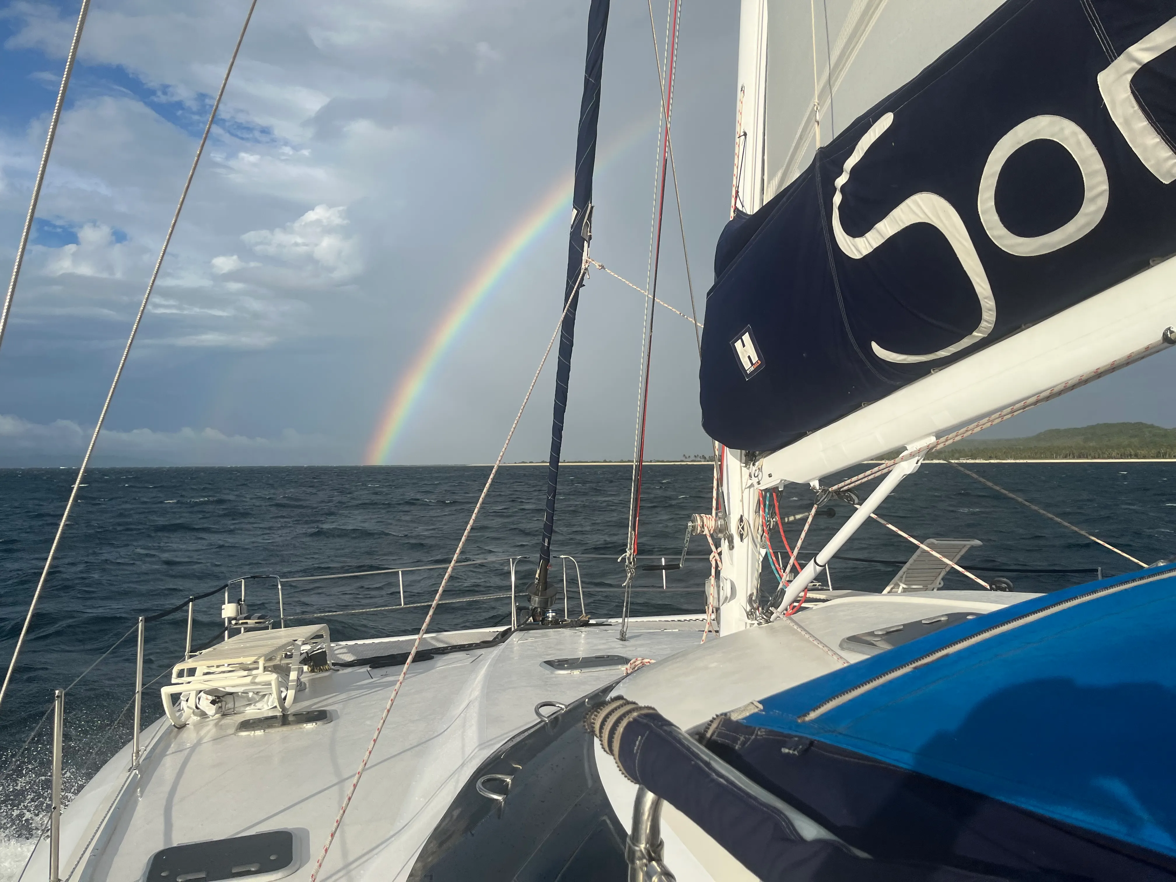 A rainbow over Soniya under sail near Mindoro