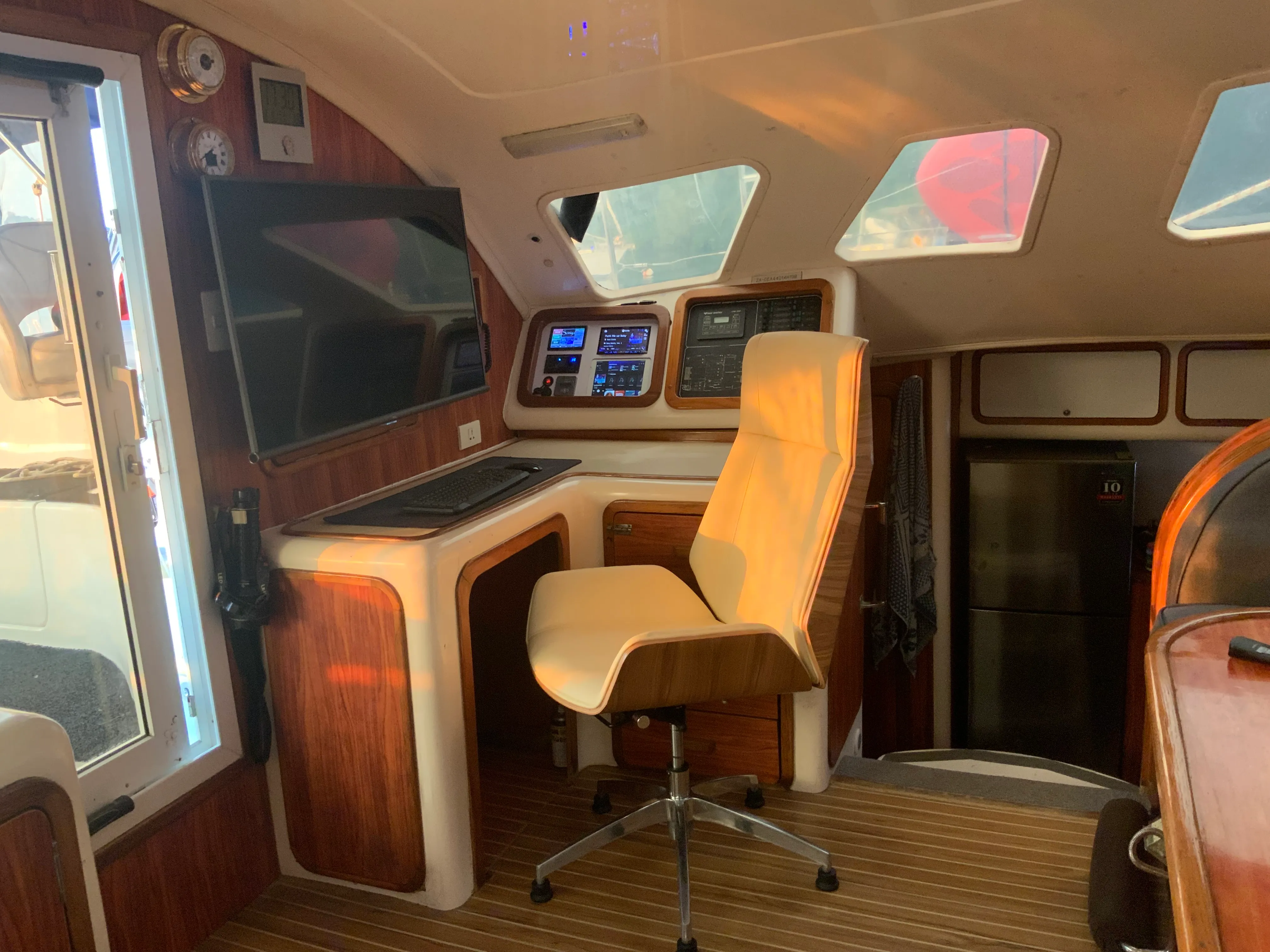 Navigation station aboard Soniya with chartplotter and instruments