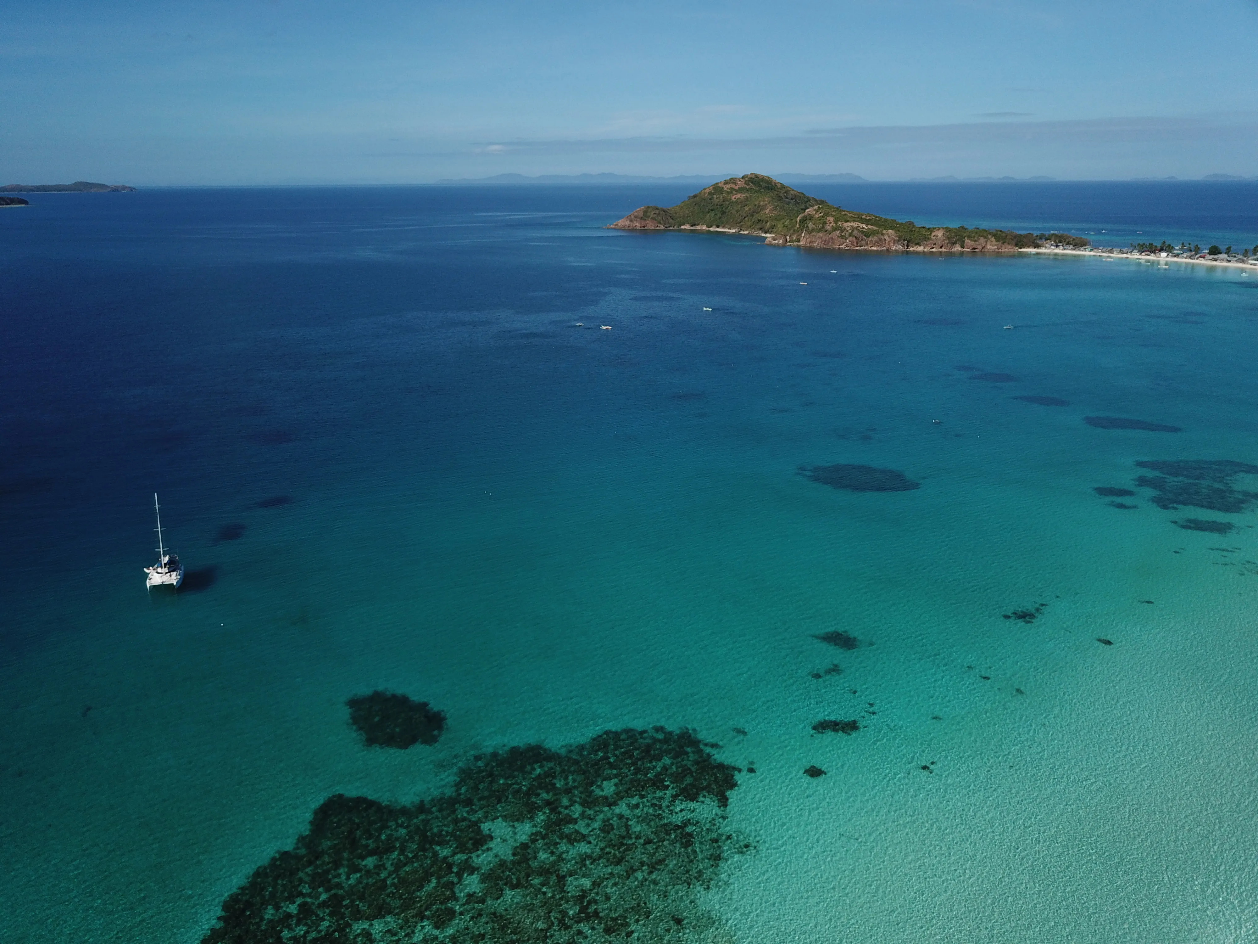 Aerial view of Soniya alone in open water off Palawan