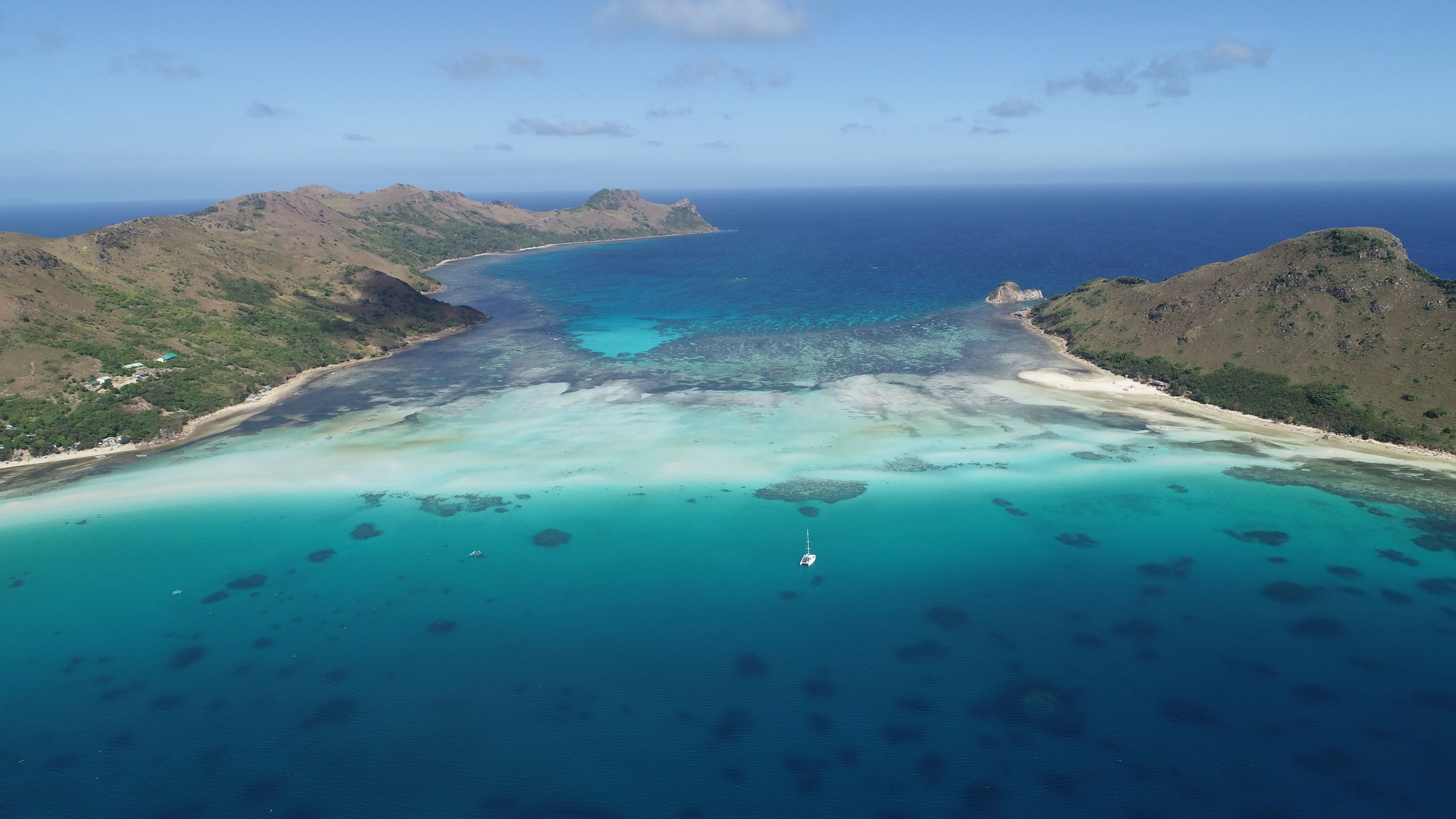 Aerial panorama of reef and atoll islands along the Palawan route