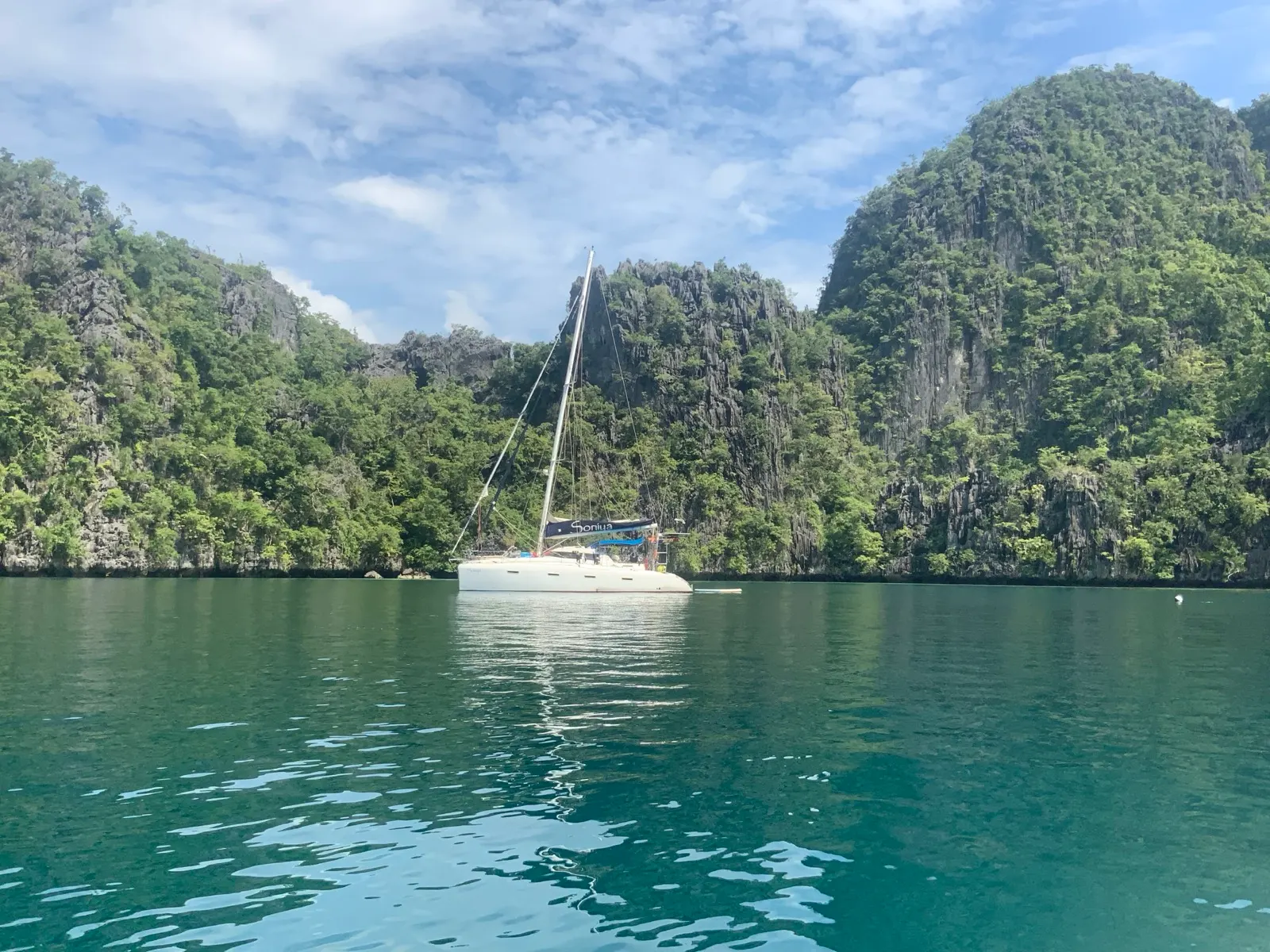 Soniya anchored near limestone cliffs and lagoon
