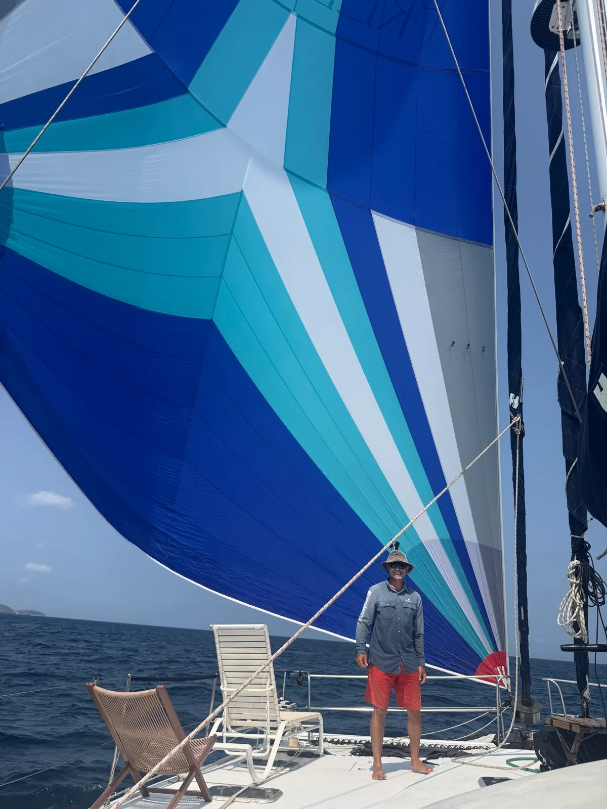 Spinnaker sail with dog and crew on deck