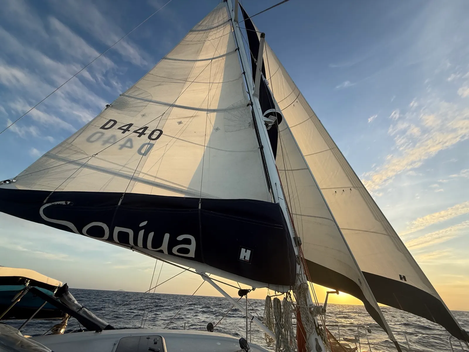 Sails lit by sunset, "Soniya" name visible