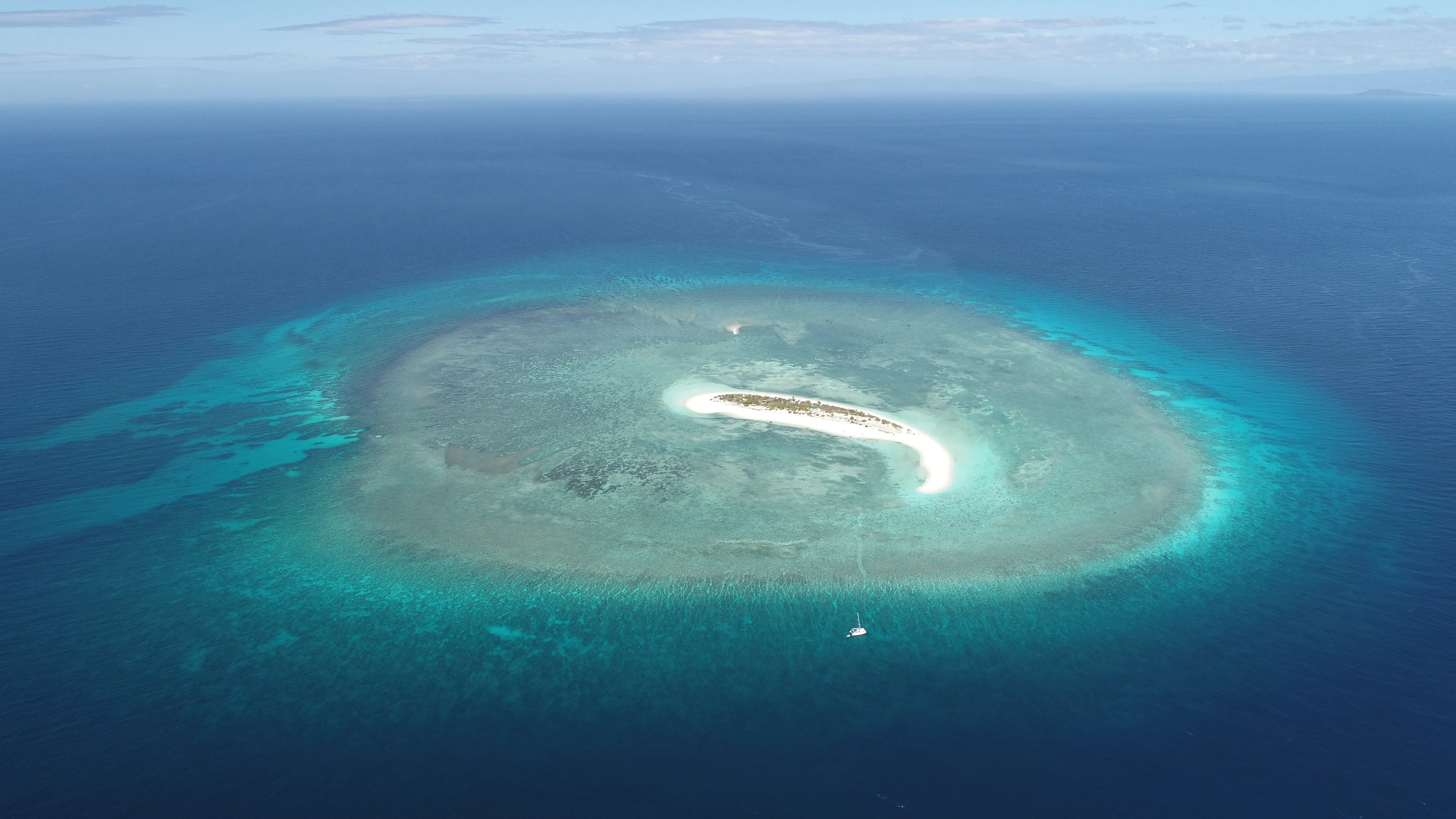 Aerial view of Seco Island's ring-shaped reef and sandbar
