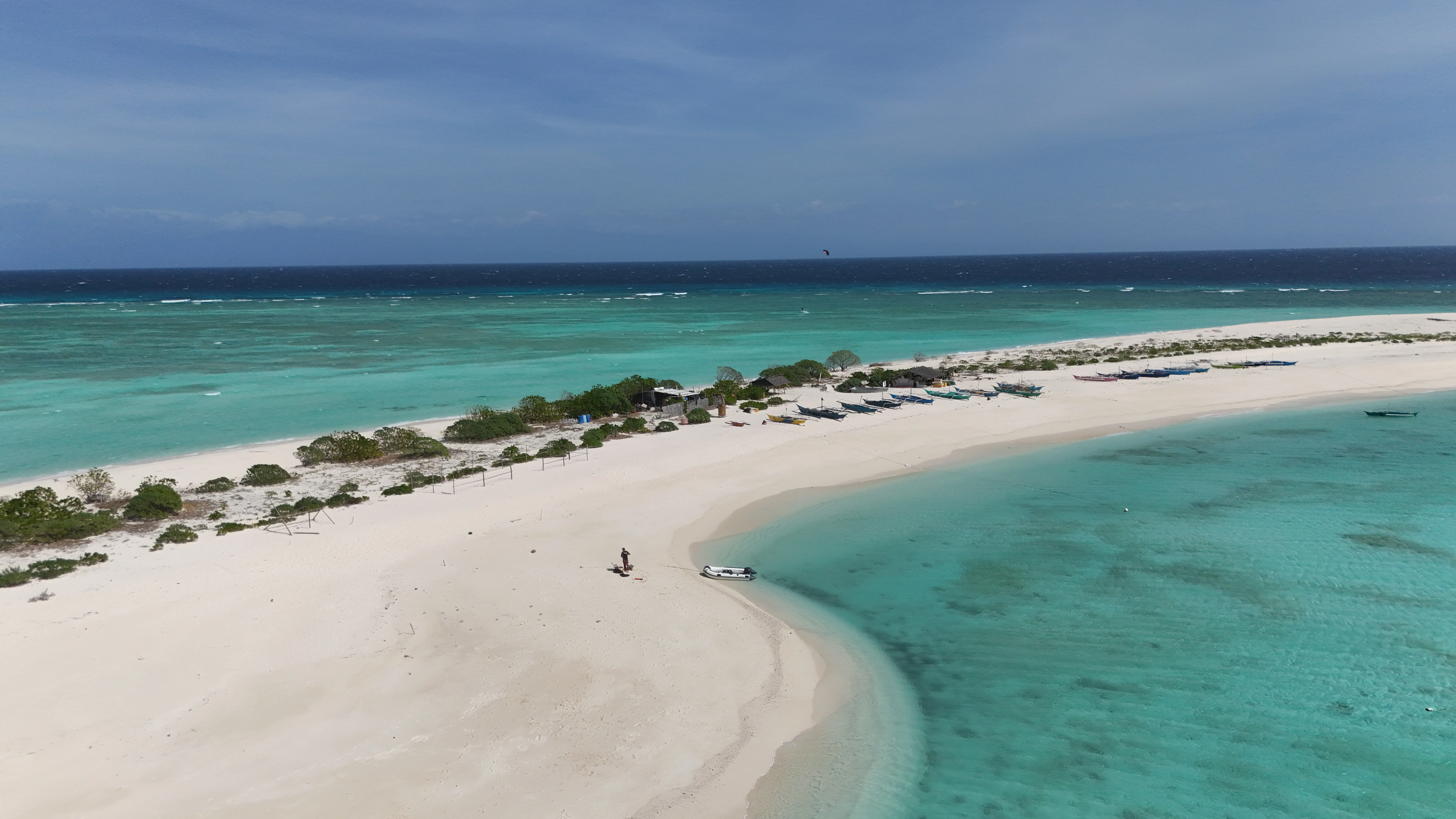 Aerial view of Seco Island's palm-lined beach