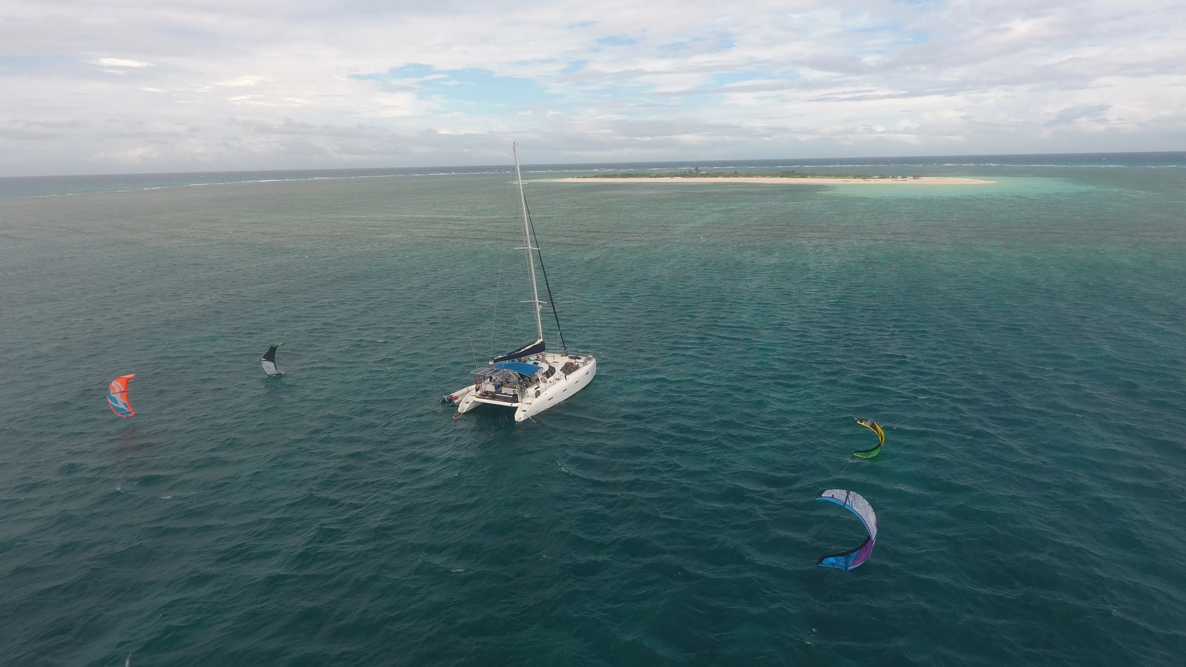 Soniya anchored off Seco Island with multiple kites flying nearby