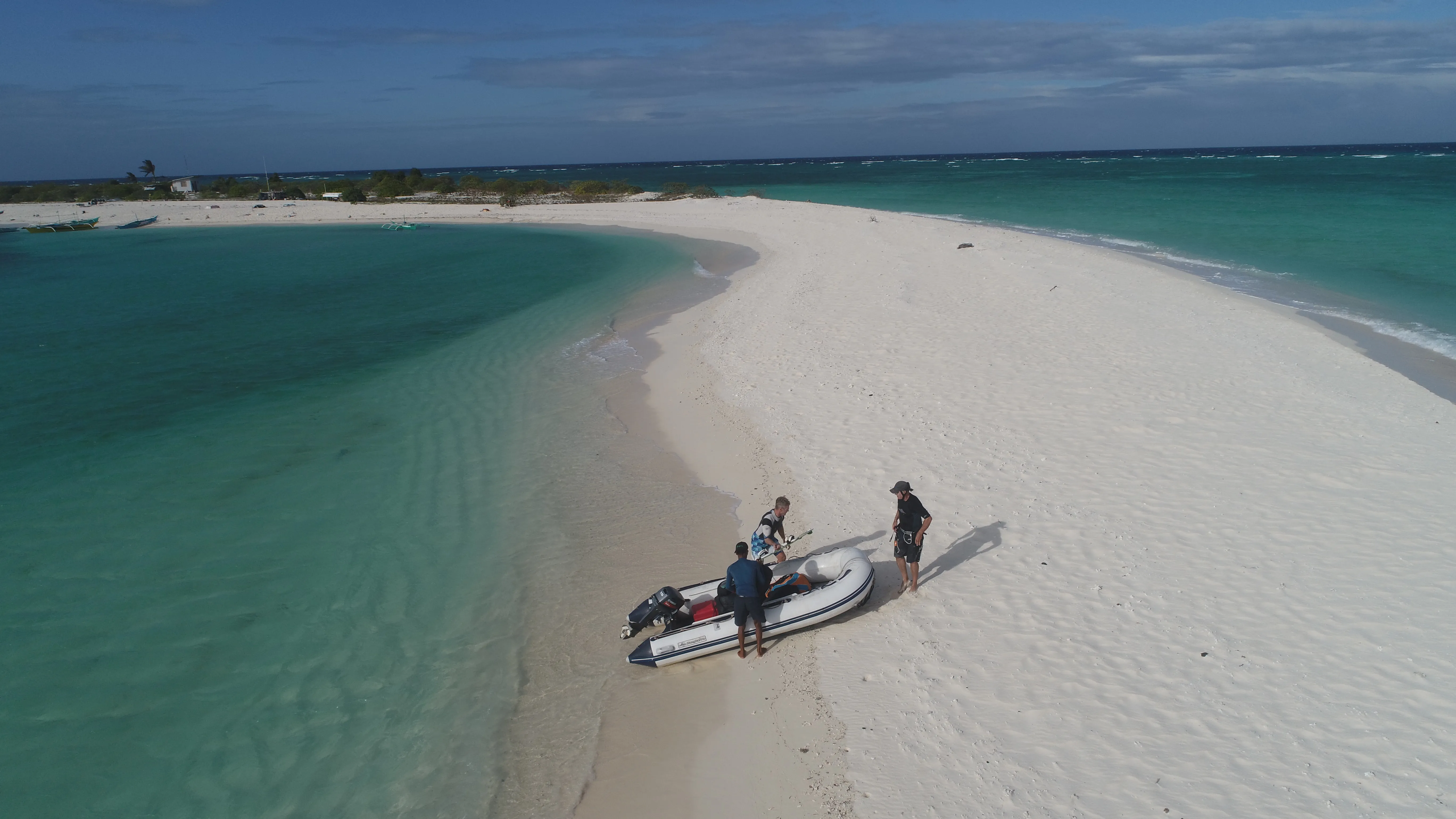 Dinghy pulled up on Seco Island's sandbar with guests aboard