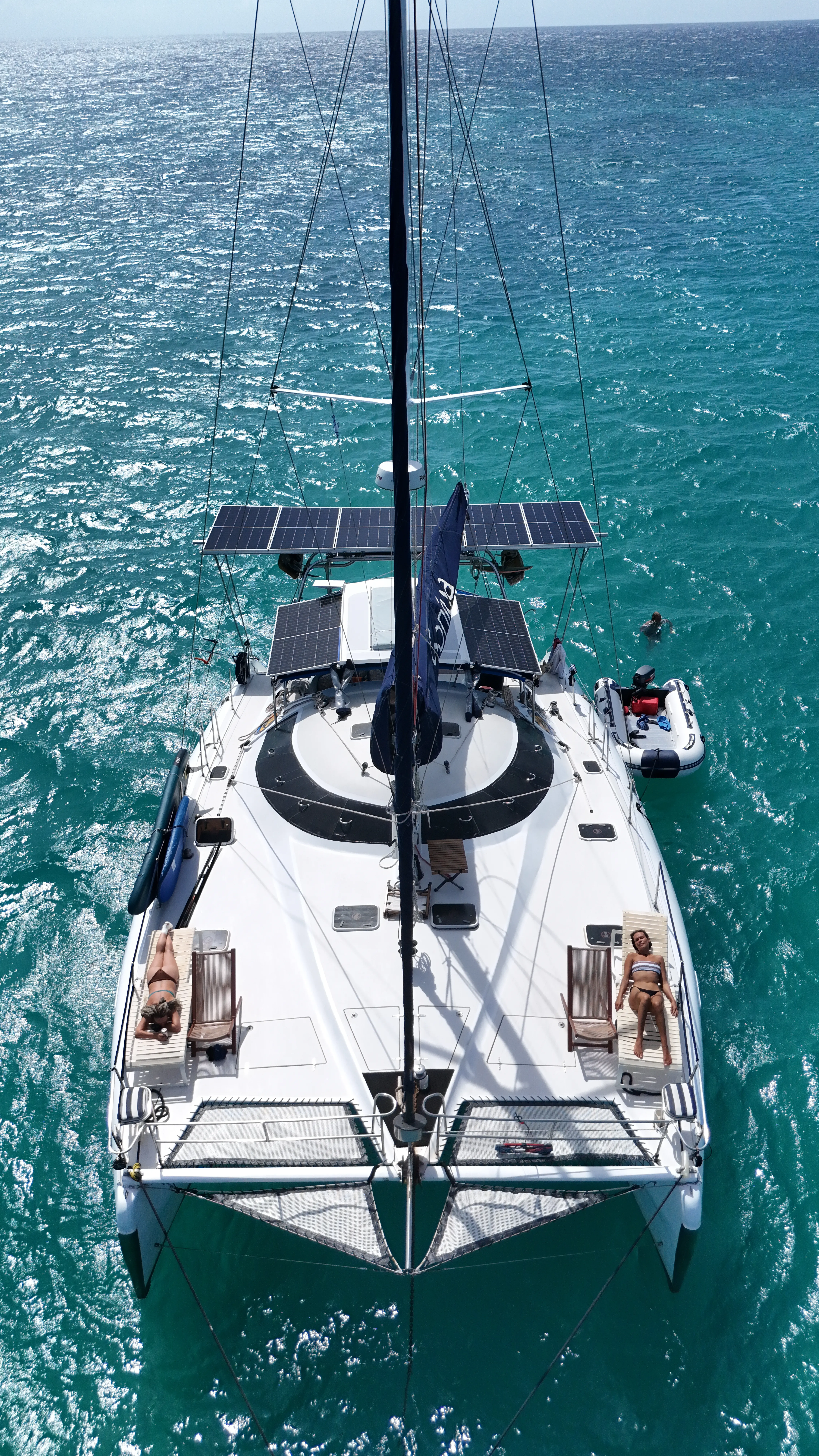 Soniya anchored in a cove surrounded by limestone cliffs