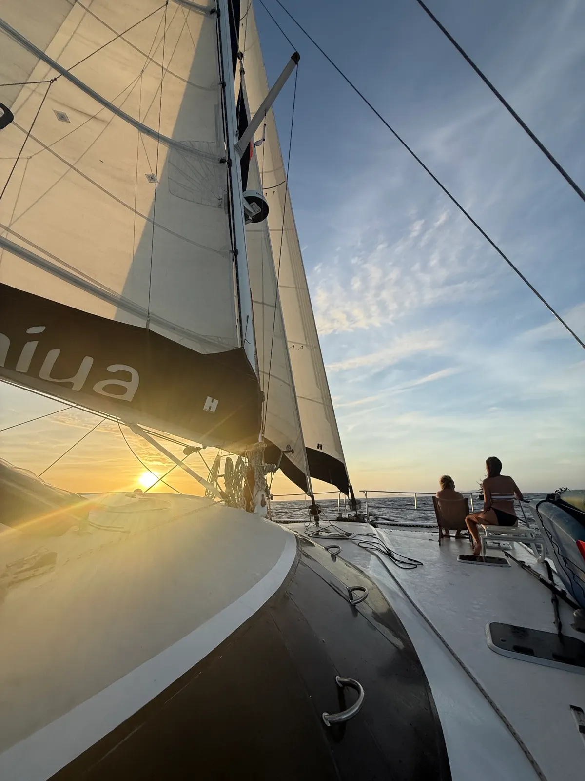 Sunset sail with crew on deck (duplicate)